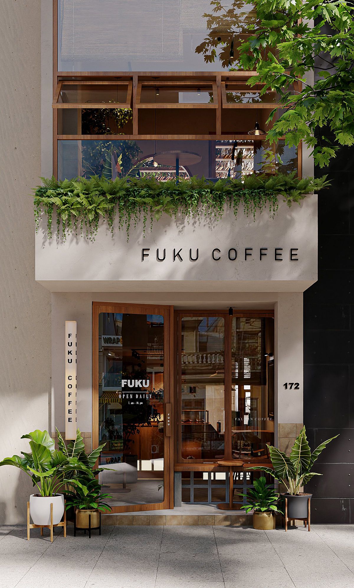 The Fuku Coffee storefront: a warm plaster façade with dimensional FUKU COFFEE lettering, teak-framed glass doors, trailing ferns along the ledge, and potted plants on the pavement.